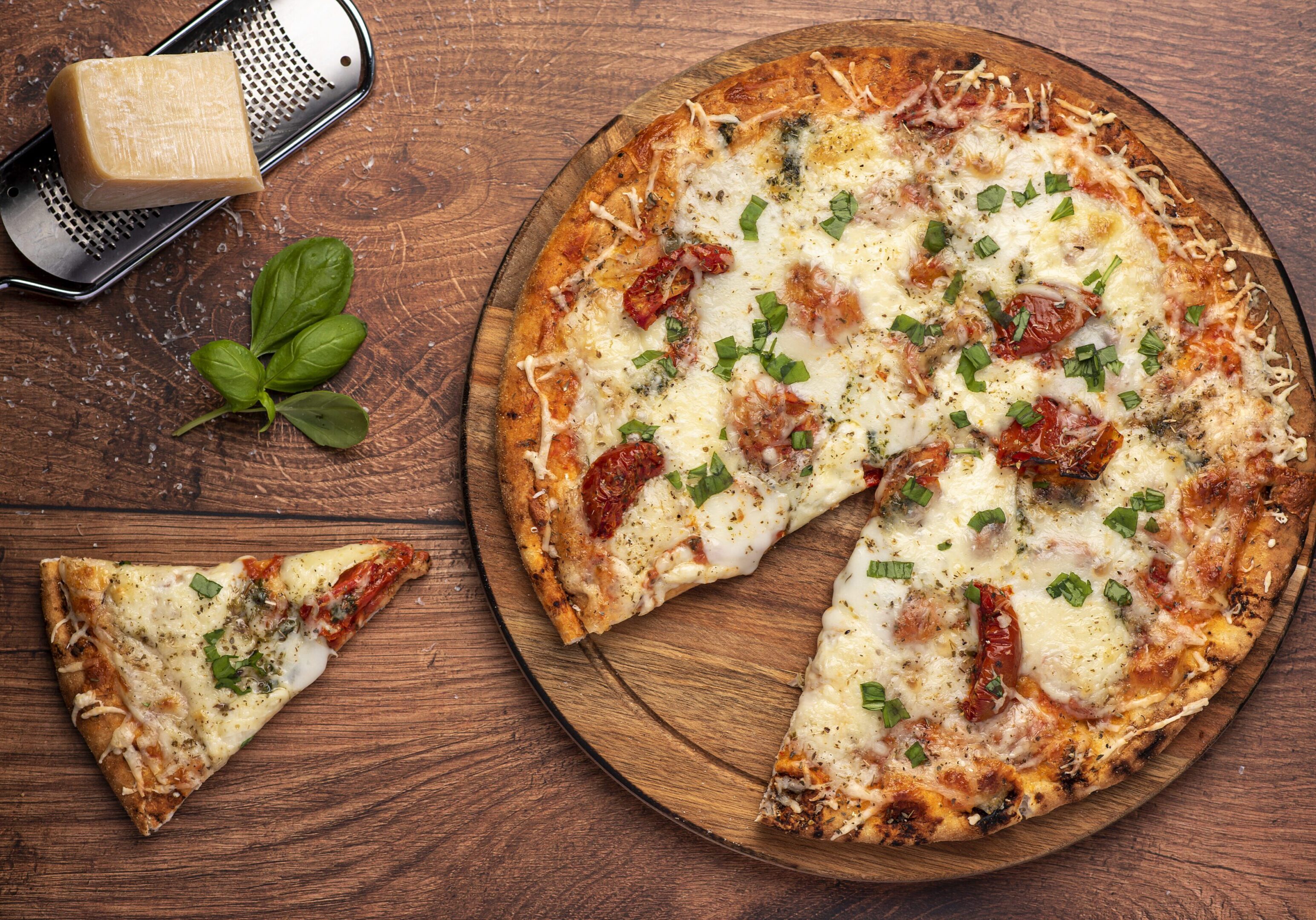 Food photography of pizza with mozzarella and parmesan Pizza with herbs and cheese on table.